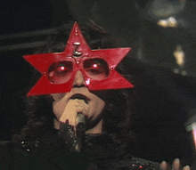 renato-zero-occhiali.gif.9c332261af55b3cb6ada32b95ea31f5a.gif